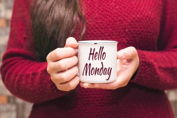 istock hello monday text on cup and woman drinking a coffee 1080927614