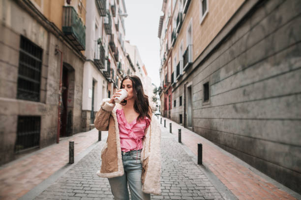 istock Young woman drinking coffee 1080934990