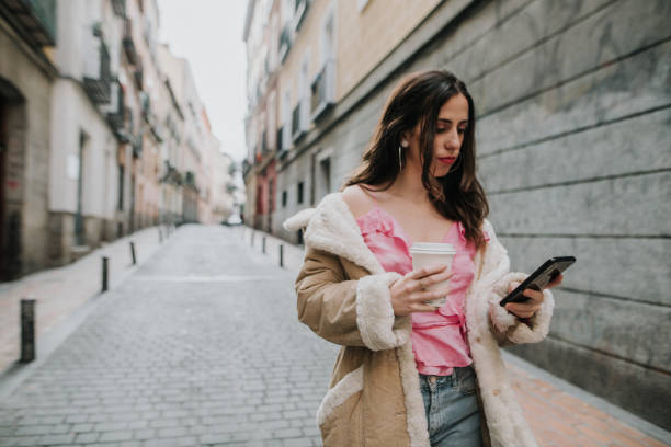 istock Young woman looking at her smartphone 1080938244
