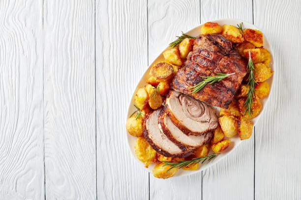 istock sliced roast pork roulade with potatoes 1080940294