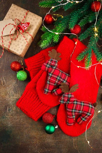 istock Christmas warm knitted red socks with deers 1080945048