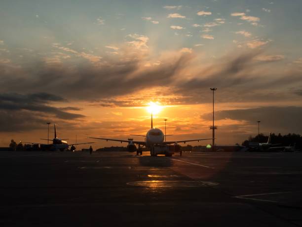 istock Towing airplane at the sunset 1080946196