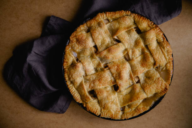 istock Apple pie with lattice decoration on beige background with a textile napkin 1080950412