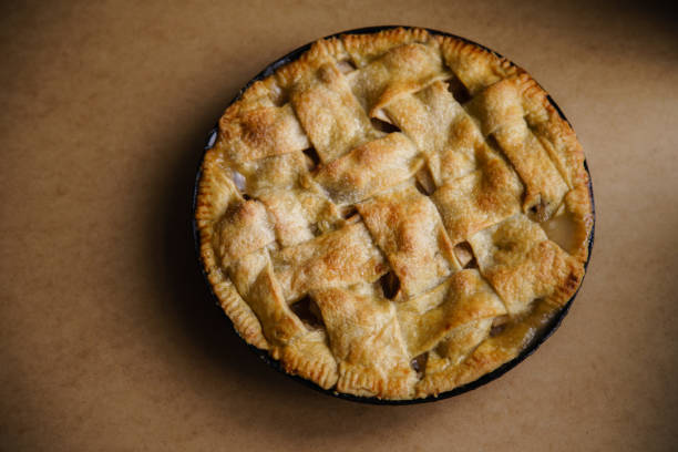 istock Apple pie with lattice decoration on beige background with a textile napkin 1080950486