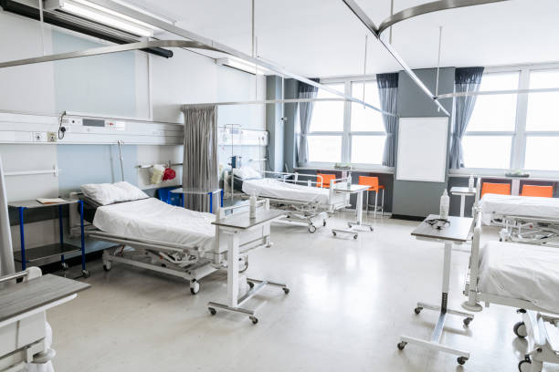 istock Clean hospital room with empty beds and windows 1080953232
