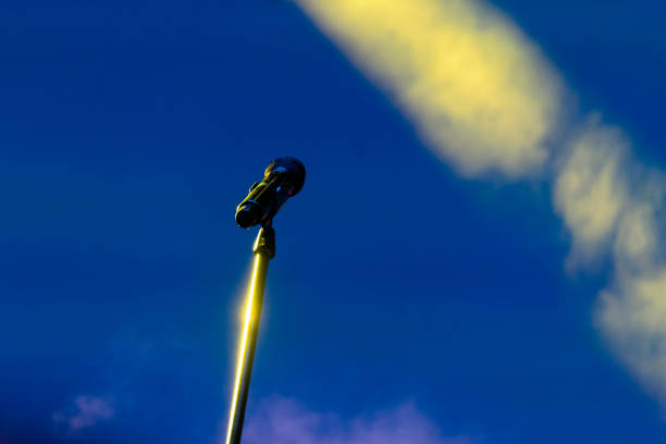 istock Microphone in nighttime outdoor concert, artificial lighting. 1080959036