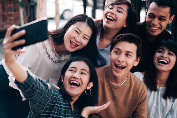 istock Group of Asian Friend Taking Selfie 1080960850