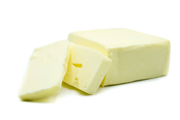 istock Piece of butter isolated on white background 1080965590