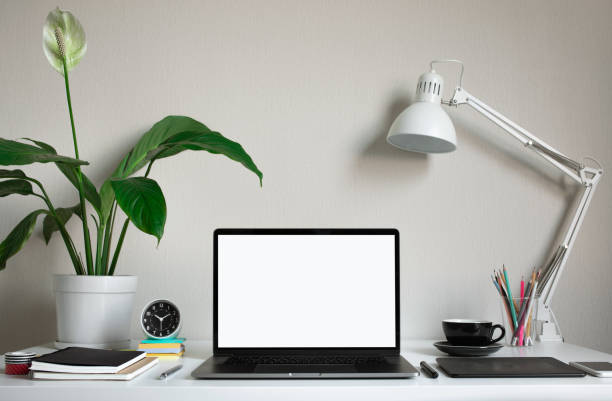 istock Modern work table with blank computer laptop and accessories in home office studio.Freelance designer or blogger concepts ideas 1080975884