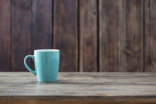 istock clean cup on old wooden background 1080977864