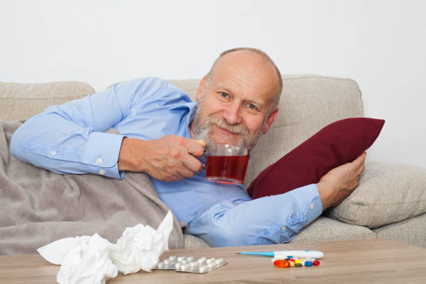 sick elderly man - painkiller thermometer tea prescription medicine imagens e fotografias de stock