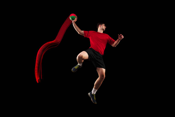 istock The one caucasian young man as handball player at studio on black background 1080986508