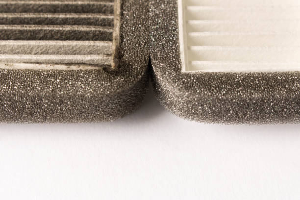istock New and old car air filter. Close up. 1080987666