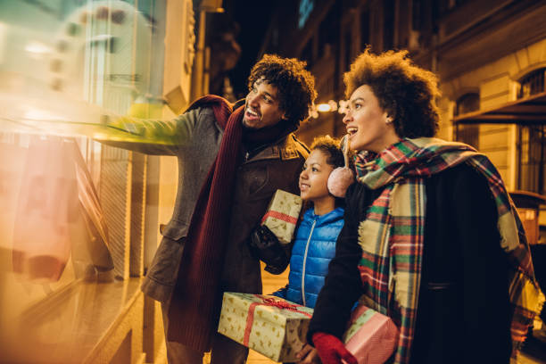 istock Happy young family looking for Christmas presents 1080990664