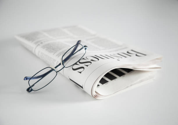 istock Newspaper and glasses 1080992494