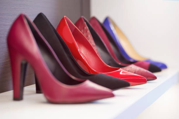 istock High-heeled shoes standing on the shelf. 1080998504