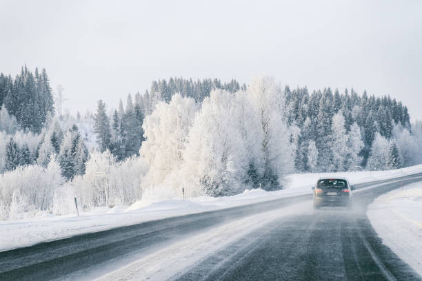 istock Car at a road a snowy winter Lapland 1081003838