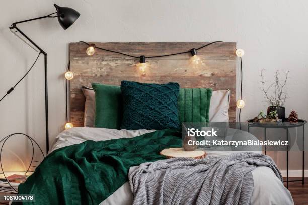 Emerald Green And Grey Bedding On Double Bed With Wooden Headboard Stock Photo - Download Image Now