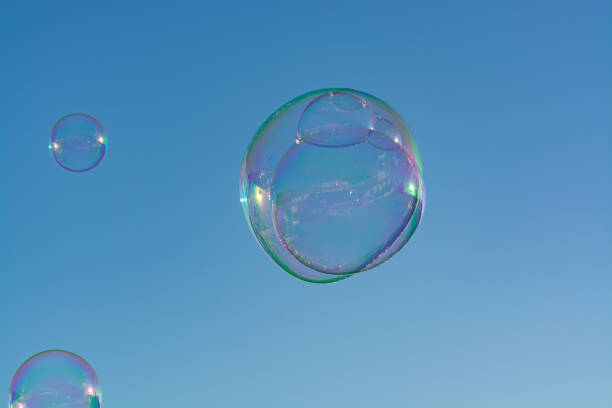 istock Many soap bubbles in air, blue sky, outdoor fun for everybody 1081004934