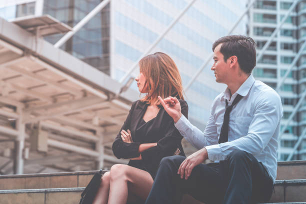 istock Office lover couple is having problem, boyfriend try to make up to girlfriend 1081007716