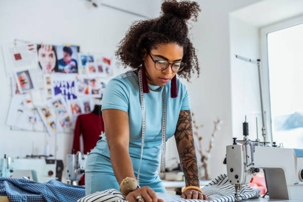 istock Curvy African American with short hair working with sewing machine 1081009820