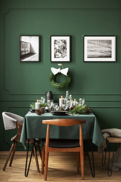 istock Bottle green dining room with table set for Christmas dinner 1081012320