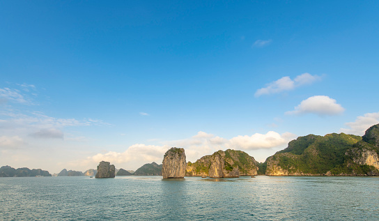 Beautiful scenery with limestone islands raising in the ocean at Halong Bay in Vietnam.