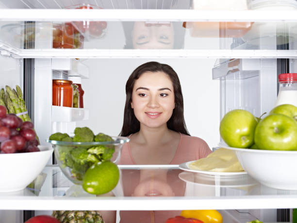 istock Woman looking into a fridge 1081019858