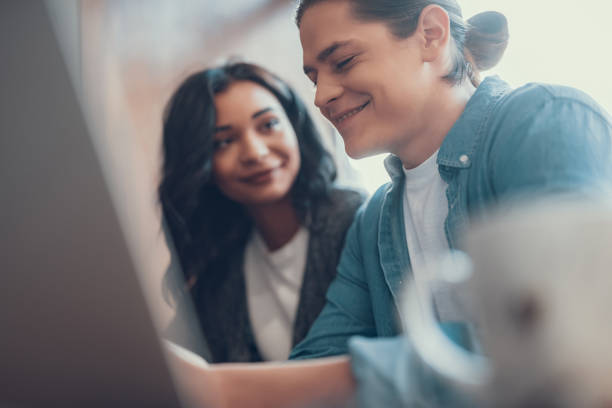 istock Emotional young man smiling and closing his eyes while being with girlfriend 1081046418
