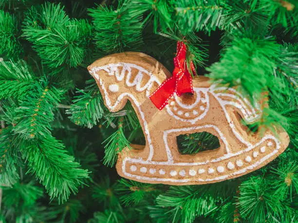 Closeup Soft focus horse gingerbread decorate on christmas tree. ChristmasDay Background.