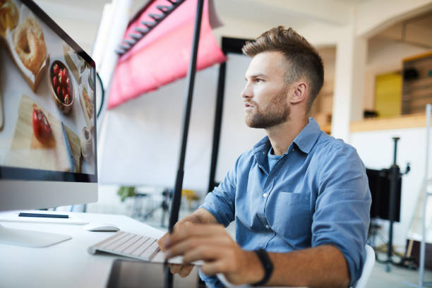 istock Photographer Editing Photos 1081051726