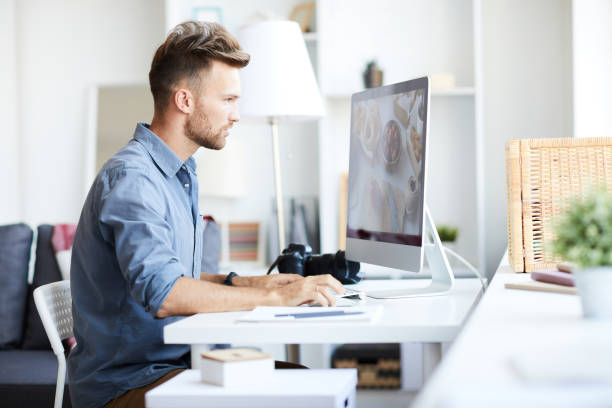 istock Professional Photographer Editing Photos 1081051812