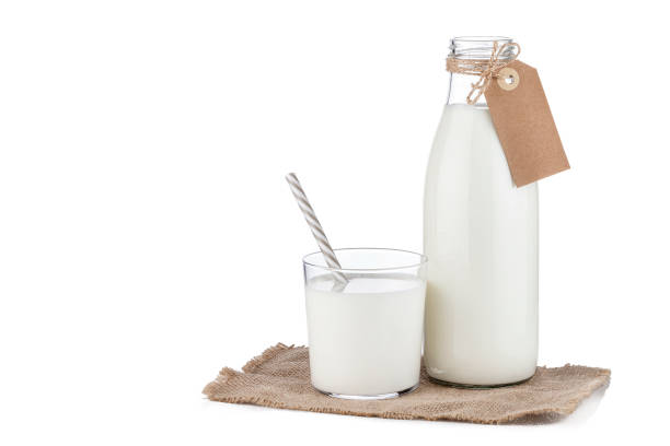Milk bottle and glass isolated on white background