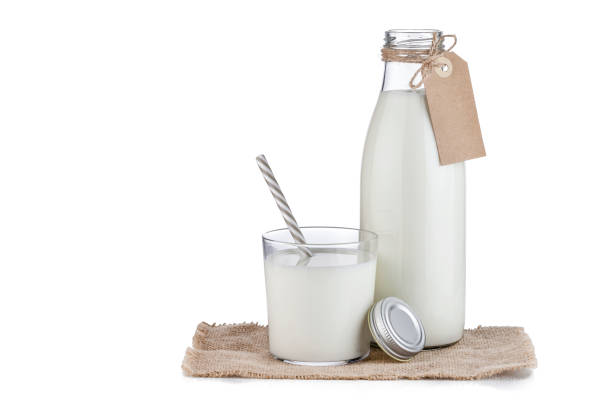 istock Milk bottle and milk glass isolated on white background 1081054180