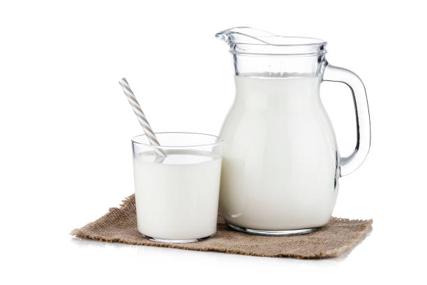 istock Milk jar and milk glass isolated on white background 1081054188