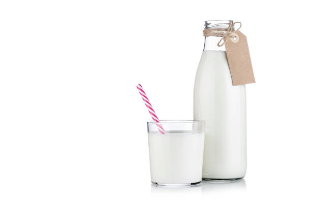 istock Milk bottle and milk glass isolated on white background 1081054210