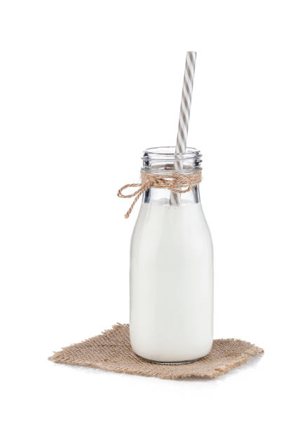 istock Milk bottle with a drinking straw isolated on white background 1081054220