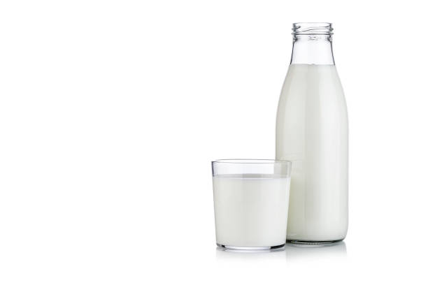 istock Milk bottle and milk glass isolated on white background 1081054236