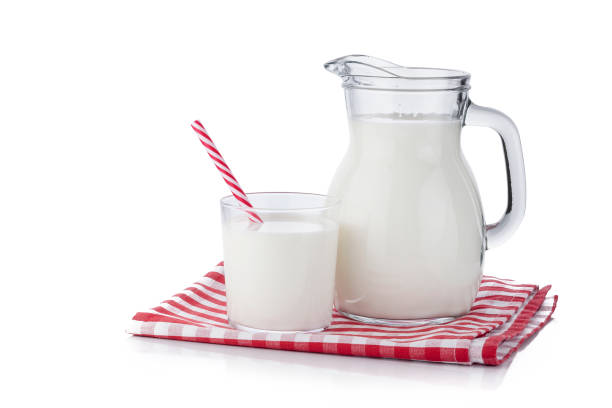 istock Milk jar and milk glass isolated on white background 1081054262