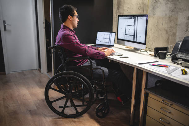 istock Architect with physical impairment working in the office 1081054768