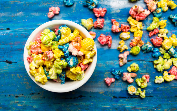 istock Colorful popcorn on a blue wooden table 1081057176