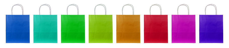 Eight colorful paper bags stand side by side.