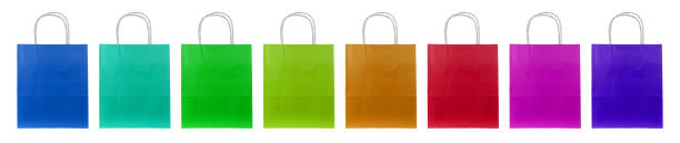 colorful paper bags Eight colorful paper bags stand side by side. silo bag stock pictures, royalty-free photos & images