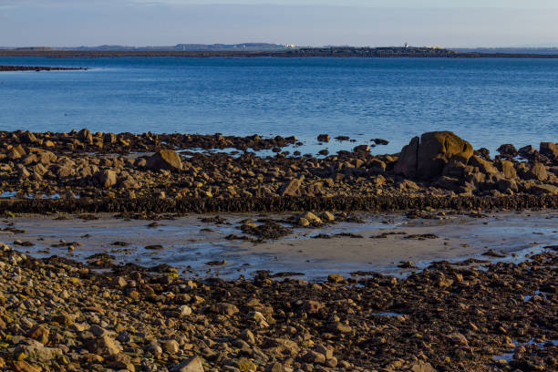 istock Rocks and sand at Salt hill beach 1081066360