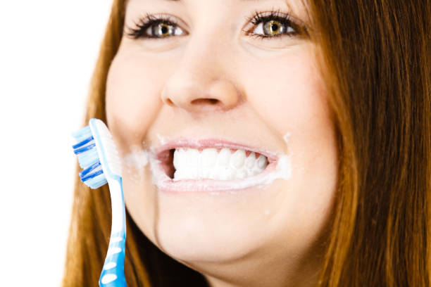 istock Woman brushing cleaning teeth. 1081070932