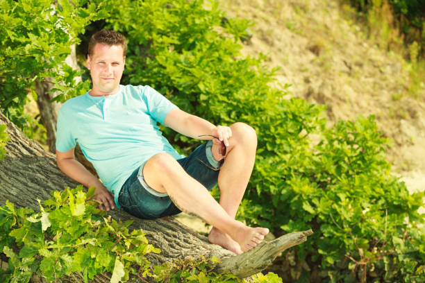 istock Man spending free time outside, looking at nature 1081071324