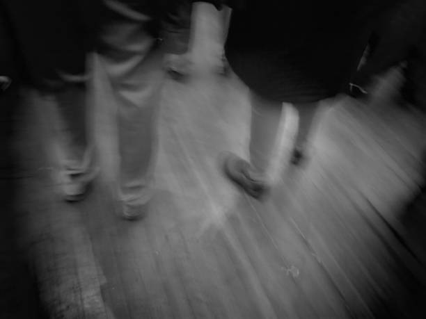 istock Black and White Blurry Artsy Background People Standing at Party 1081079008