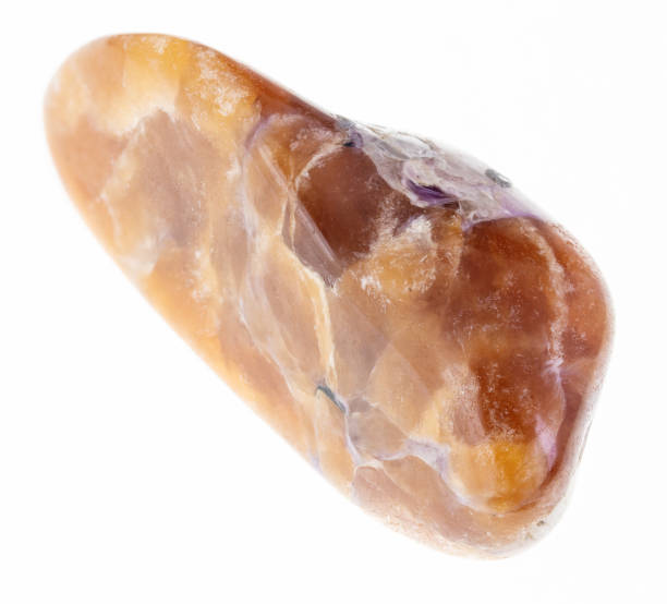 istock polished tinaksite gem stone on white 1081085288