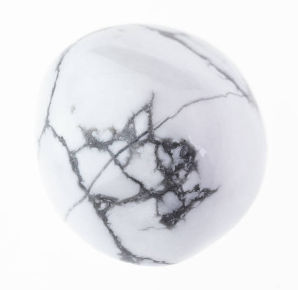 istock tumbled howlite gem stone on white 1081085374
