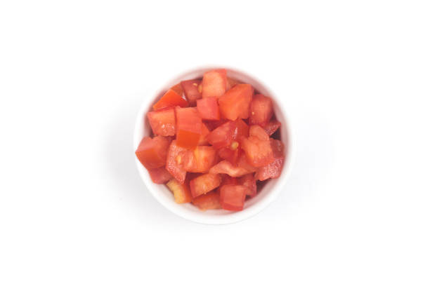 istock Chopped Tomatoes in a white bowl Top view 1081086278